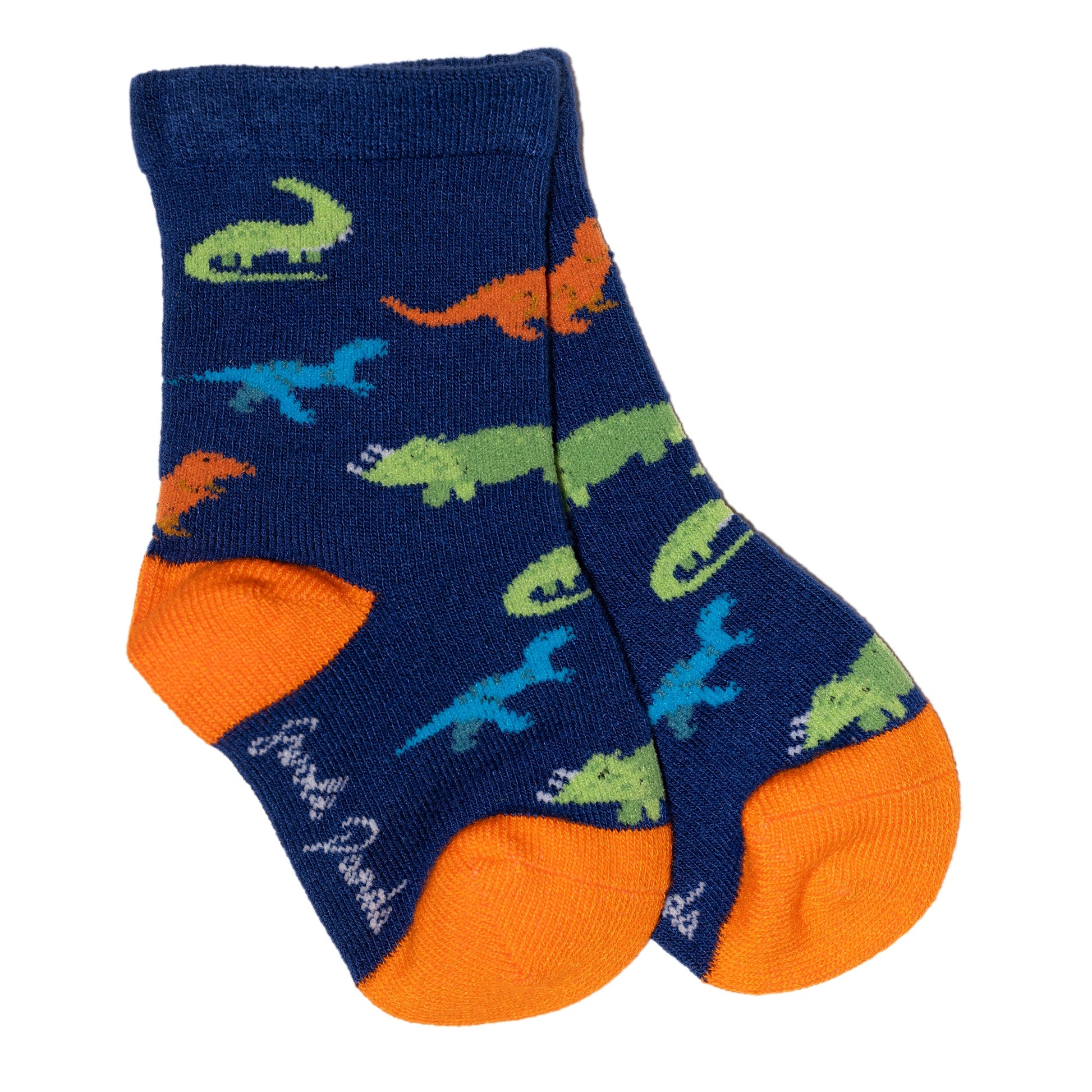 Single pair of children's socks. An orange toe and heel. The main body of the socks are navy blue and covered in lighter blue, orange and green dinosaurs