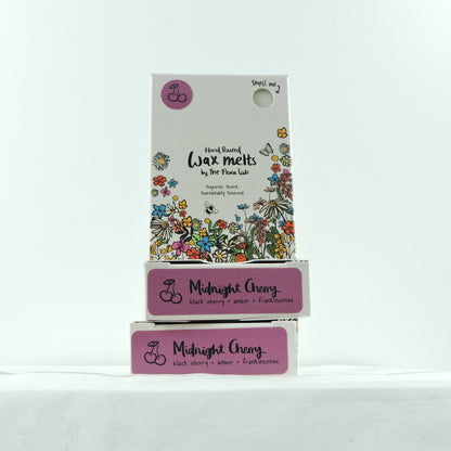 Box of Wax Melts with a floral design and "Midnight Cherry" on the label, with a white background